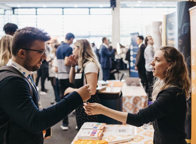 Image of two people at a networking event