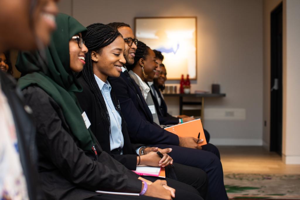 Attendees listening to a speech